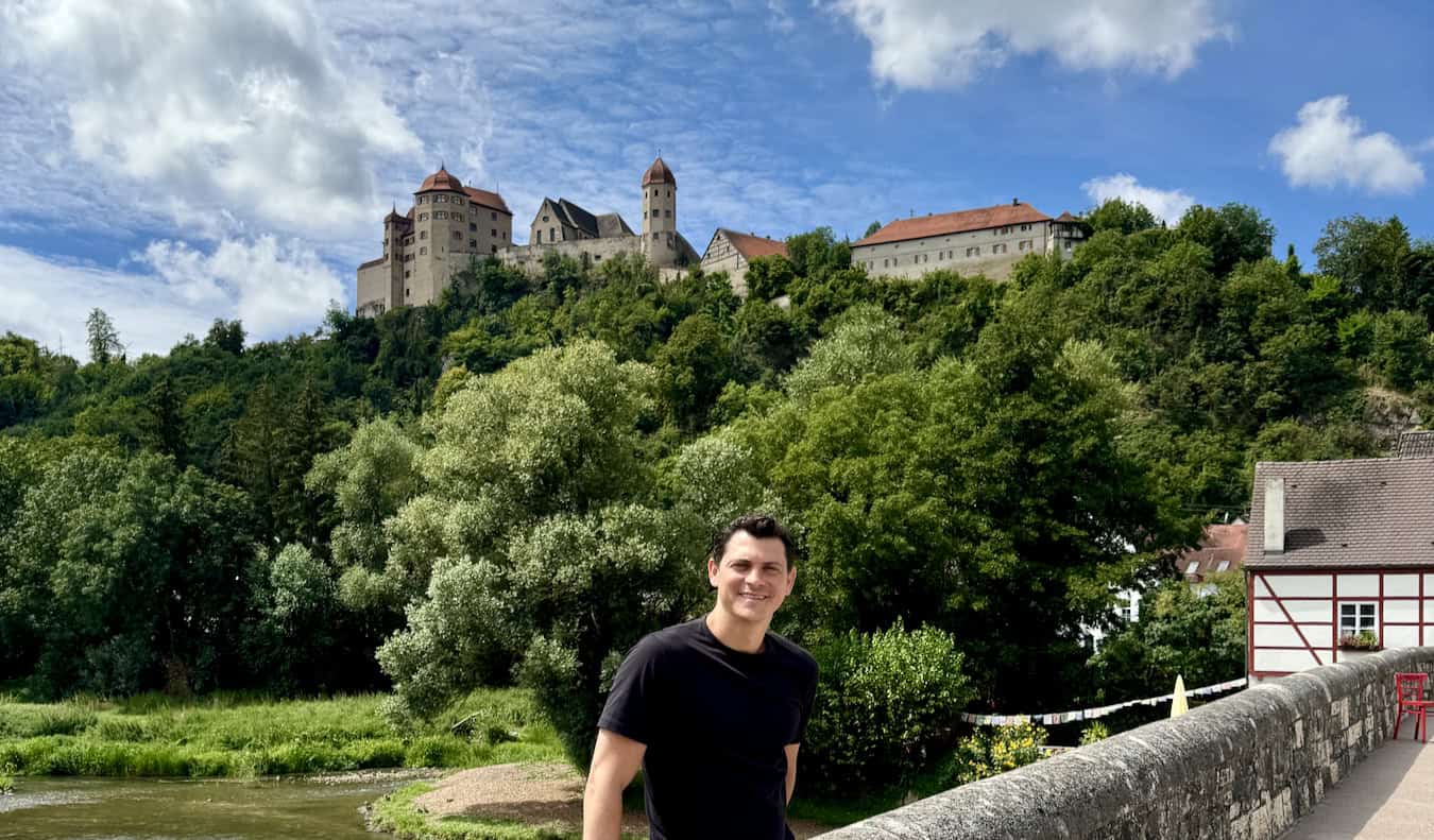 Nomadic Matt posing for a photo on a sunny day while exploring the Black Forest area of Germany